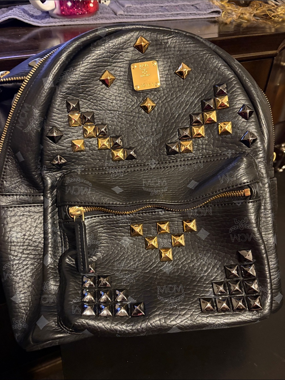 MCM Black Leather Studded Backpack with Gold Accents